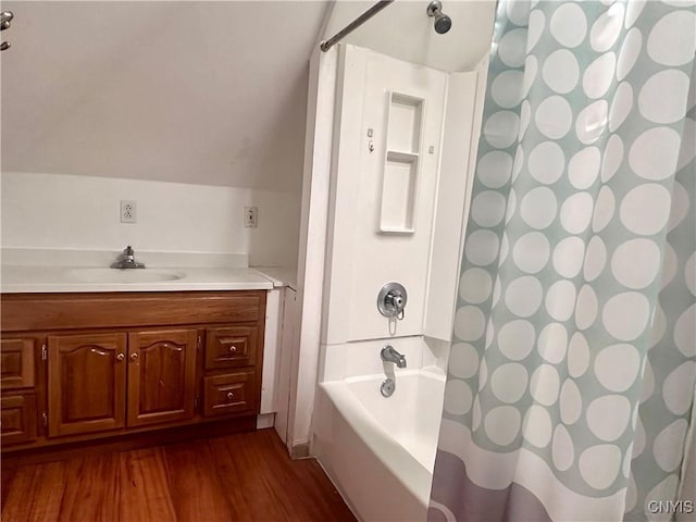 36 Lincoln Ave, Cortland, NY 13045 - bathroom featuring vanity, shower / bath combo, lofted ceiling, and wood finished floors