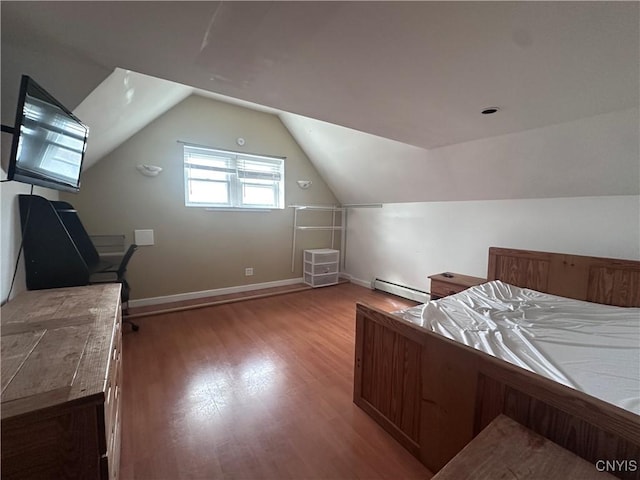 36 Lincoln Ave, Cortland, NY 13045 - bedroom with baseboards, vaulted ceiling, a baseboard heating unit, and light wood finished floors