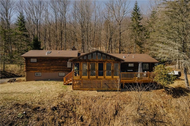 38 Woodchuck Rd, Roxbury, NY 12474 - rear view of property with a chimney, a sunroom, a deck, and a forest view