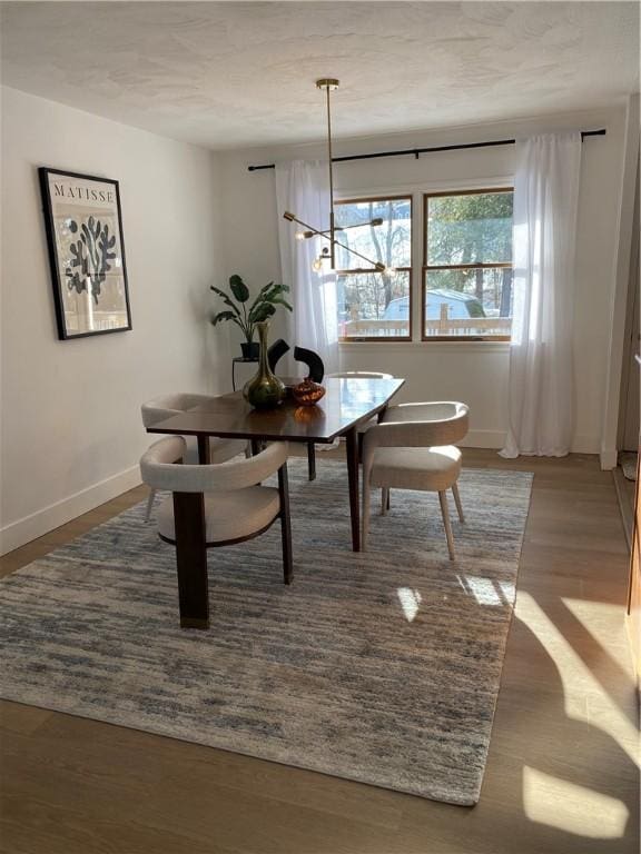 115 Aster Dr, Horseheads, NY 14845 - dining area with baseboards and wood finished floors