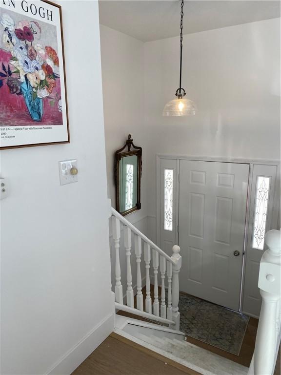 115 Aster Dr, Horseheads, NY 14845 - foyer entrance featuring baseboards and wood finished floors