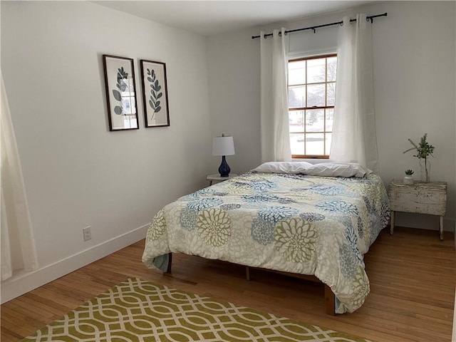 115 Aster Dr, Horseheads, NY 14845 - bedroom with baseboards and wood finished floors