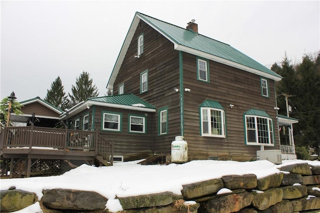 500 Farnham Rd, Sanford, NY 13865 - snow covered house featuring metal roof, a deck, and a chimney