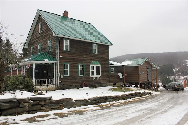 500 Farnham Rd, Sanford, NY 13865 - snow covered back of property with a chimney and metal roof