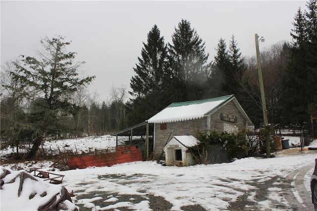 500 Farnham Rd, Sanford, NY 13865 - view of snow covered exterior with metal roof and an outdoor structure