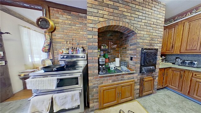 500 Farnham Rd, Sanford, NY 13865 - kitchen with light countertops, range with two ovens, decorative backsplash, and brown cabinets