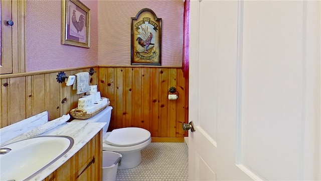 500 Farnham Rd, Sanford, NY 13865 - half bathroom featuring a wainscoted wall, vanity, toilet, and wallpapered walls