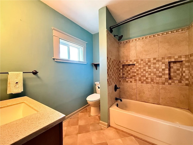 full bath featuring baseboards, toilet, vanity, shower / washtub combination, and tile patterned flooring
