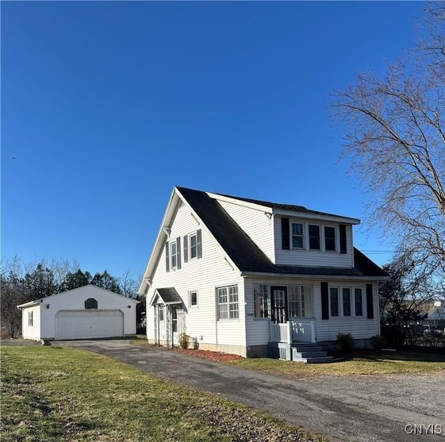 3428 Seneca Tpke, Lenox, NY 13032 - view of front facade featuring a front yard, an outbuilding, and a garage