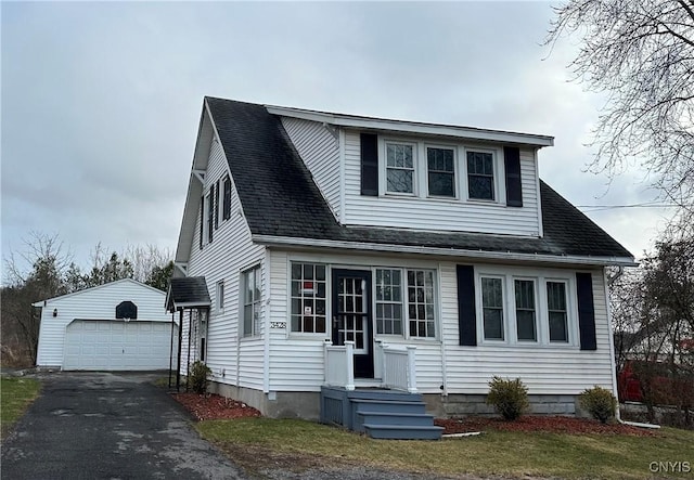3428 Seneca Tpke, Lenox, NY 13032 - view of front of house featuring an outbuilding, a garage, and roof with shingles