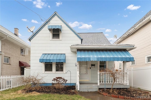 2486 Willow Ave, Niagara Falls, NY 14305 - view of front of property featuring covered porch, fence, and roof with shingles