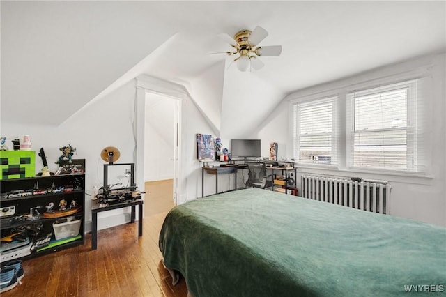 2486 Willow Ave, Niagara Falls, NY 14305 - bedroom featuring hardwood / wood-style floors, lofted ceiling, radiator heating unit, and a ceiling fan