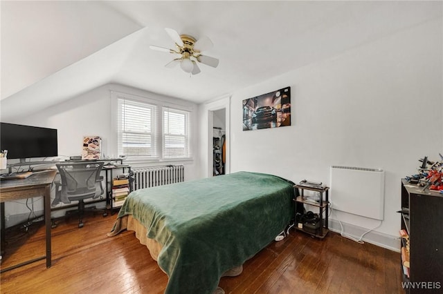 2486 Willow Ave, Niagara Falls, NY 14305 - bedroom with hardwood / wood-style flooring, vaulted ceiling, a ceiling fan, and radiator
