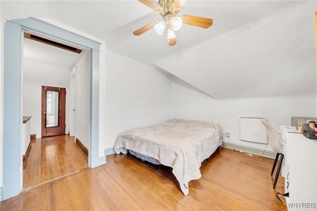 2486 Willow Ave, Niagara Falls, NY 14305 - bedroom featuring baseboards, lofted ceiling, ceiling fan, and light wood finished floors