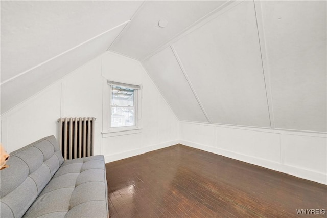 2486 Willow Ave, Niagara Falls, NY 14305 - bonus room with dark wood-type flooring, lofted ceiling, a decorative wall, and radiator heating unit