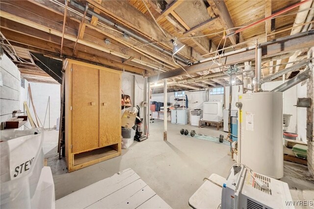 2486 Willow Ave, Niagara Falls, NY 14305 - basement featuring gas water heater and washer and clothes dryer