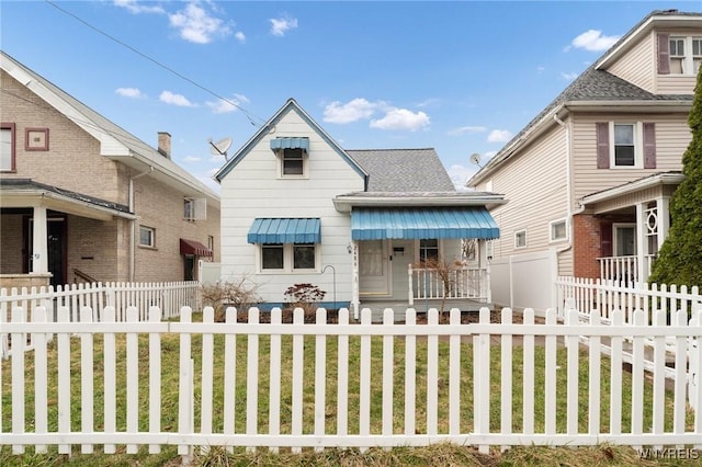 2486 Willow Ave, Niagara Falls, NY 14305 - bungalow-style house featuring a fenced front yard and roof with shingles