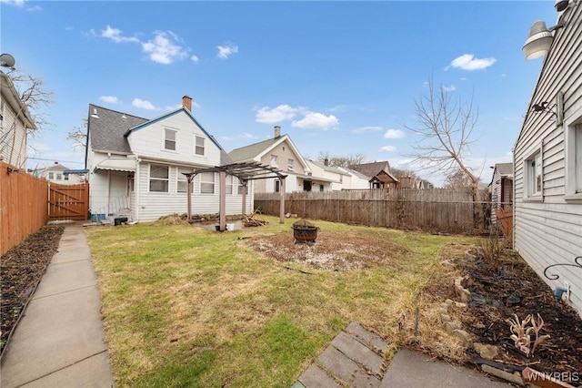2486 Willow Ave, Niagara Falls, NY 14305 - view of yard featuring a fenced backyard and an outdoor fire pit