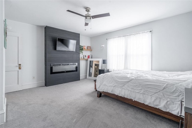 120 Westmont Ave, Elmira, NY 14905 - carpeted bedroom featuring baseboards, a ceiling fan, and a fireplace