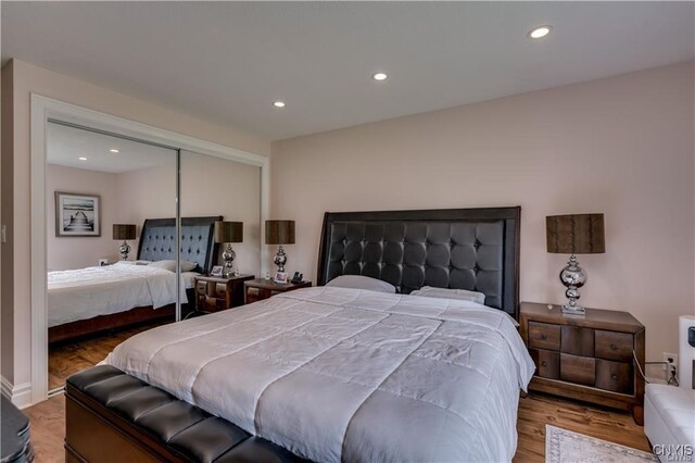22036 Riverbend Dr W, Le Ray, NY 13601 - bedroom with a closet, wood finished floors, and recessed lighting