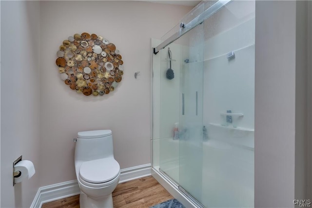 22036 Riverbend Dr W, Le Ray, NY 13601 - full bath featuring a stall shower, baseboards, wood finished floors, and toilet