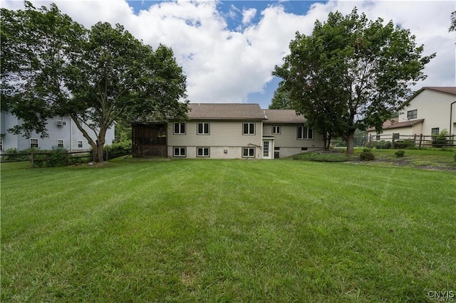 22036 Riverbend Dr W, Le Ray, NY 13601 - rear view of property featuring fence and a yard