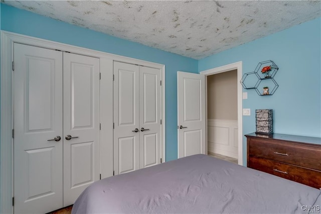 22036 Riverbend Dr W, Le Ray, NY 13601 - unfurnished bedroom with a wainscoted wall