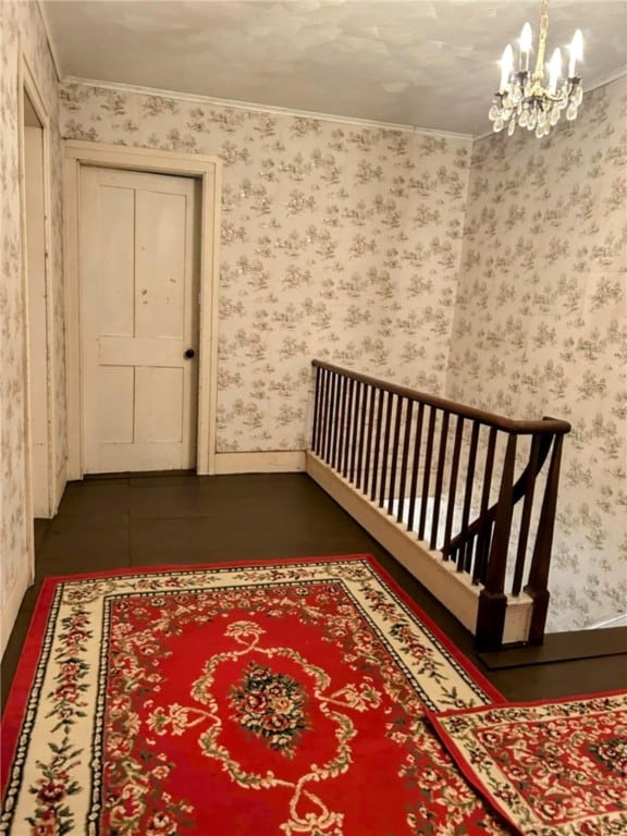 810 River Rd, Sanford, NY 13754 - hall with a chandelier, wallpapered walls, and crown molding