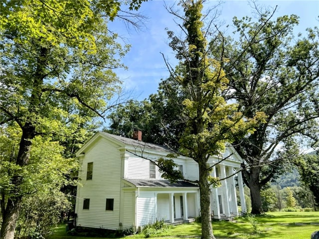810 River Rd, Sanford, NY 13754 - view of home's exterior with a lawn and a chimney