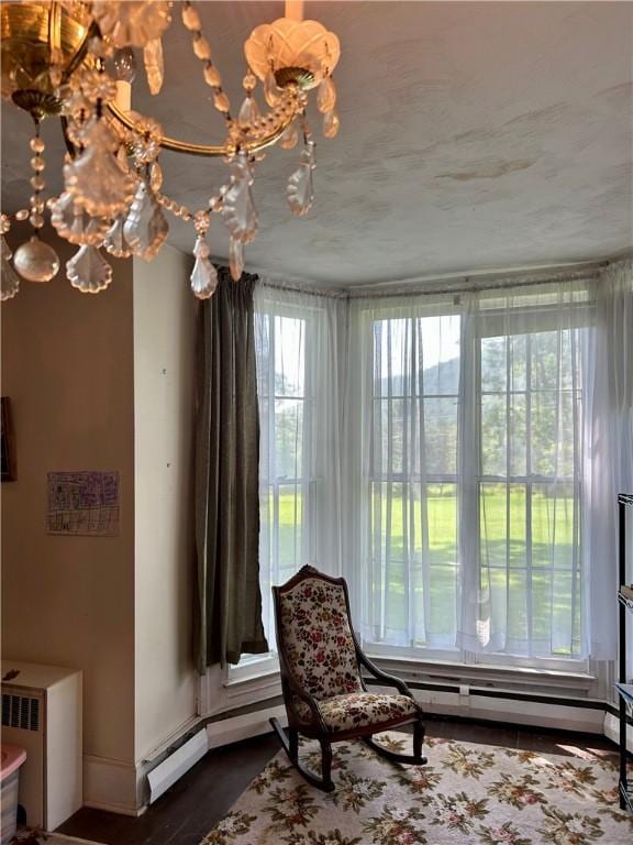 810 River Rd, Sanford, NY 13754 - sitting room with baseboards and dark wood-style flooring