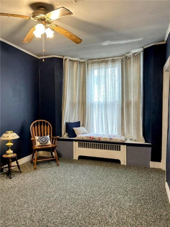 810 River Rd, Sanford, NY 13754 - sitting room with radiator heating unit, carpet flooring, ornamental molding, and a ceiling fan