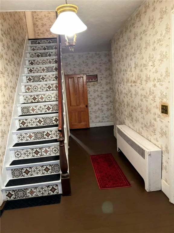 810 River Rd, Sanford, NY 13754 - staircase featuring wallpapered walls and radiator heating unit