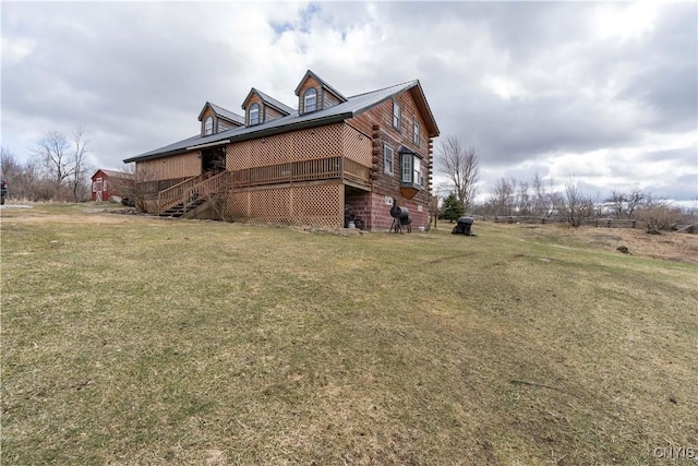 view of property exterior featuring log siding and a lawn