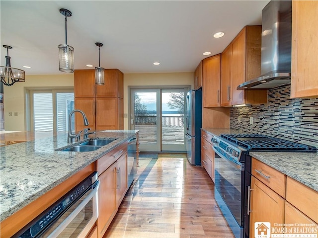 5464 Crestwood Rd, Ellery, NY 14712 - kitchen with light stone counters, a sink, wall chimney exhaust hood, stainless steel appliances, and light wood-style floors