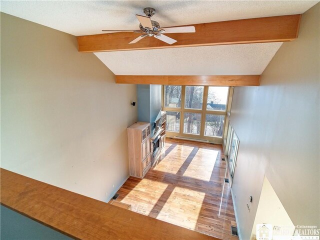 5464 Crestwood Rd, Ellery, NY 14712 - hall with wood finished floors, lofted ceiling with beams, and a textured ceiling