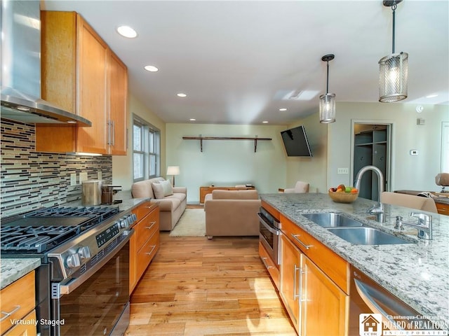 5464 Crestwood Rd, Ellery, NY 14712 - kitchen with a sink, stainless steel appliances, wall chimney range hood, and open floor plan