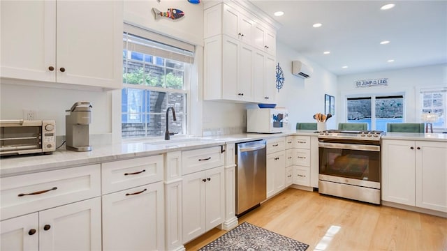 5170 Sunnyside Rd, Italy, NY 14507 - kitchen featuring white cabinets, a toaster, appliances with stainless steel finishes, a sink, and a wall unit AC