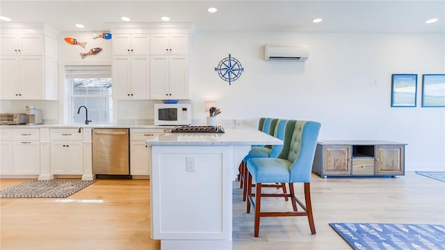 5170 Sunnyside Rd, Italy, NY 14507 - kitchen with a wall unit AC, a breakfast bar, dishwasher, a peninsula, and white microwave