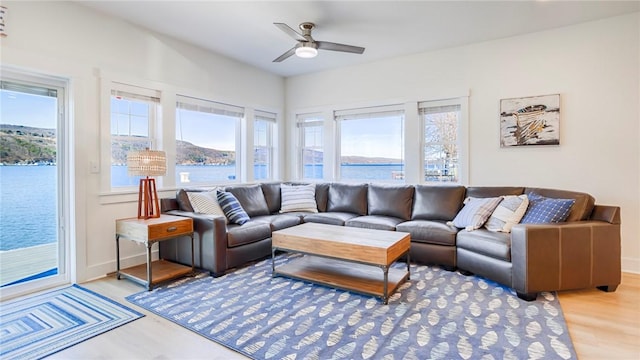 5170 Sunnyside Rd, Italy, NY 14507 - living area with baseboards, light wood-type flooring, a water view, and ceiling fan