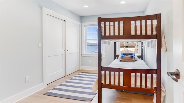 5170 Sunnyside Rd, Italy, NY 14507 - bedroom with baseboards, a closet, wood finished floors, and recessed lighting