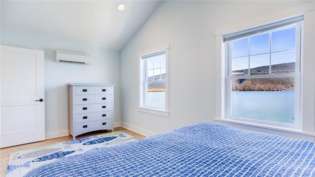5170 Sunnyside Rd, Italy, NY 14507 - bedroom with baseboards, lofted ceiling, wood finished floors, and a wall mounted air conditioner