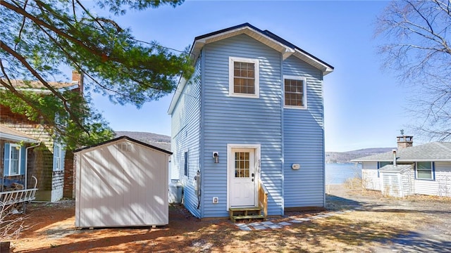 5170 Sunnyside Rd, Italy, NY 14507 - rear view of property with an outbuilding, a shed, and entry steps