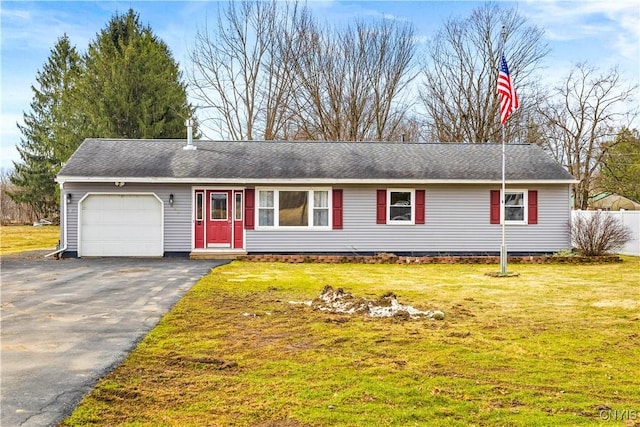 single story home featuring roof with shingles, fence, driveway, a front lawn, and a garage