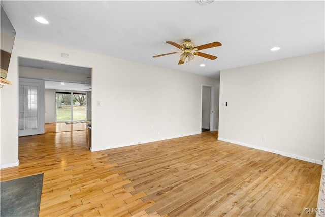 empty room with baseboards, light wood-type flooring, ceiling fan, and recessed lighting