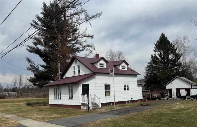 view of home's exterior with a chimney and a yard