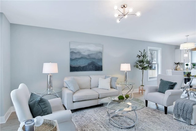 00 Beattie Ave, Lockport-Town, NY 14094 - living area featuring a notable chandelier, baseboards, and light wood-type flooring