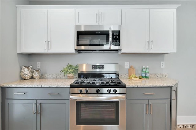 00 Beattie Ave, Lockport-Town, NY 14094 - kitchen featuring gray cabinets, light stone counters, and appliances with stainless steel finishes