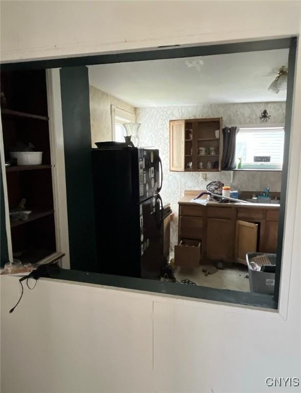 24 Spring St, German Flatts, NY 13357 - kitchen featuring plenty of natural light, freestanding refrigerator, and open shelves