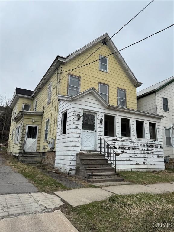 traditional-style house with entry steps