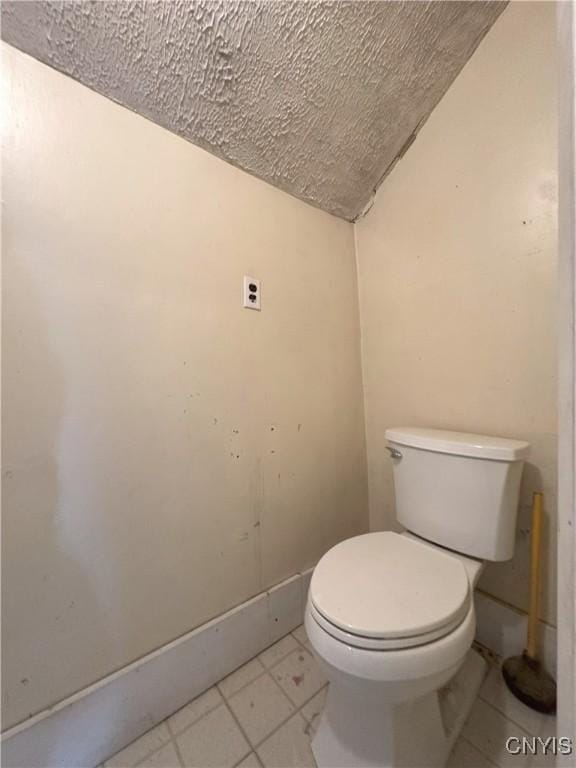 37754 County Route 194, Antwerp, NY 13608 - bathroom featuring toilet, baseboards, and a textured ceiling